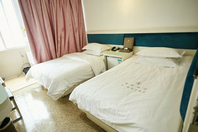 Imagen de la habitación del Hotel Xinghe Xinfeng - Railway Station. Foto 13