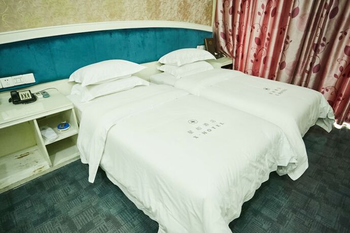 Imagen de la habitación del Hotel Xinghe Xinfeng - Railway Station. Foto 16
