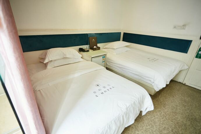 Imagen de la habitación del Hotel Xinghe Xinfeng - Railway Station. Foto 17