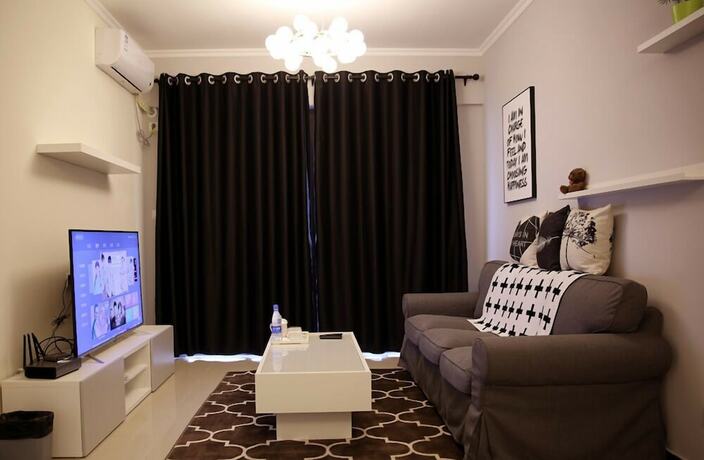Imagen de la habitación del Hotel Xinguang Apartment. Foto 11