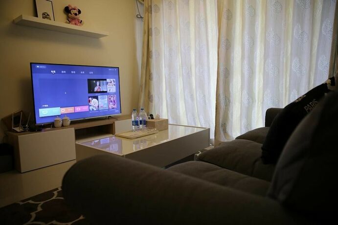 Imagen de la habitación del Hotel Xinguang Apartment. Foto 12