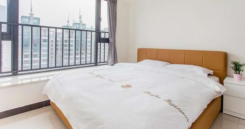 Imagen de la habitación del Hotel Xinguang Apartment. Foto 13