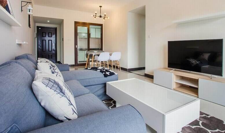Imagen de la habitación del Hotel Xinguang Apartment. Foto 14