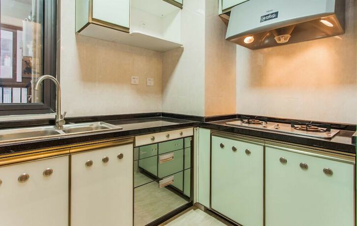 Imagen de la habitación del Hotel Xinguang Apartment. Foto 15