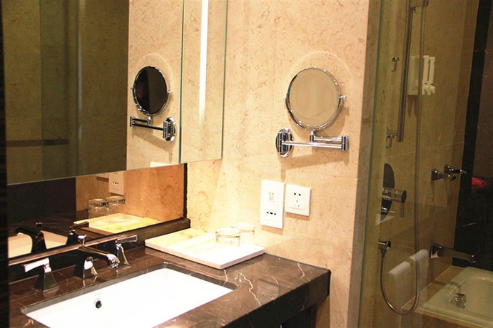 Imagen de la habitación del Hotel Xingyi International Poly Store. Foto 2