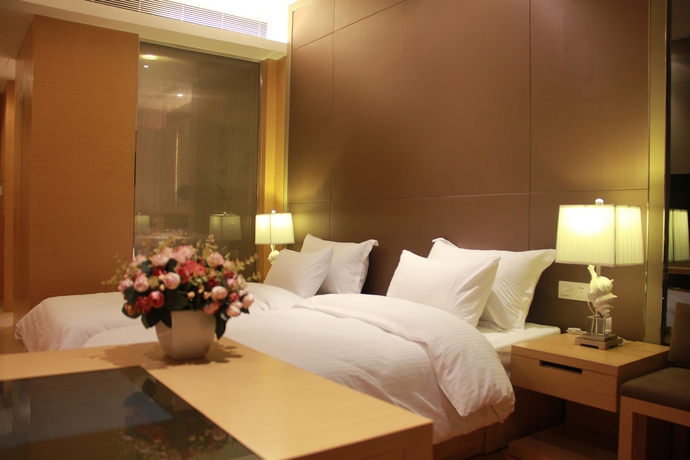 Imagen de la habitación del Hotel Xingyi International Poly Store. Foto 3