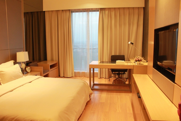 Imagen de la habitación del Hotel Xingyi International Poly Store. Foto 7