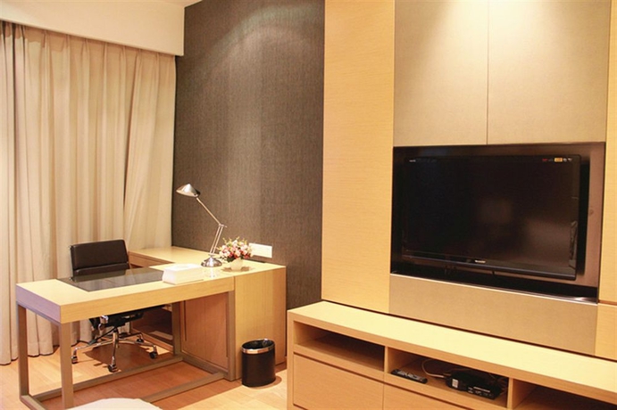 Imagen de la habitación del Hotel Xingyi International Poly Store. Foto 8