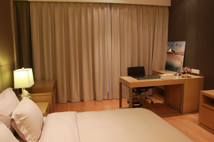 Imagen de la habitación del Hotel Xingyi International Poly Store. Foto 10