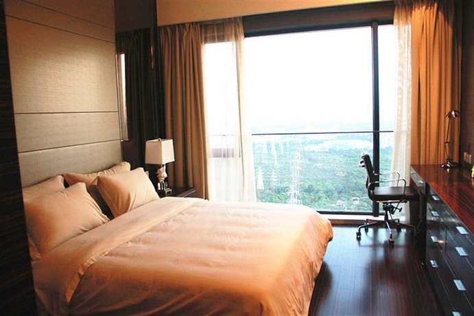 Imagen de la habitación del Hotel Xingyi International Poly Store. Foto 11