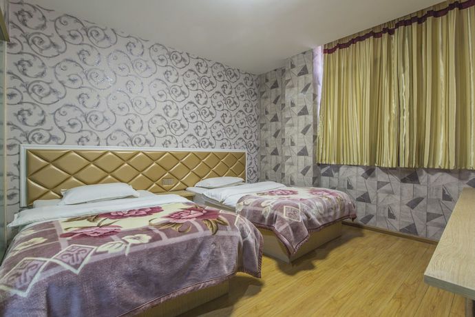 Imagen de la habitación del Hotel Xingyu Boutique. Foto 13