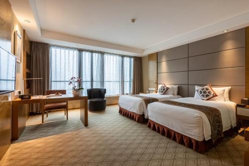 Imagen de la habitación del Hotel Xinhua Media. Foto 15