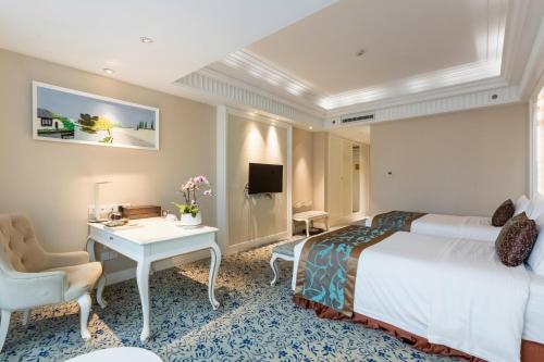 Imagen de la habitación del Hotel Xinhua Media. Foto 18