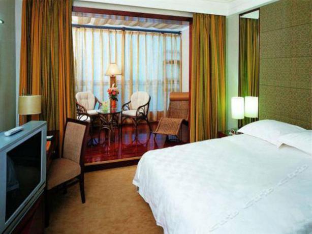 Imagen de la habitación del Hotel Xinjiang Plaza Guest Building. Foto 7