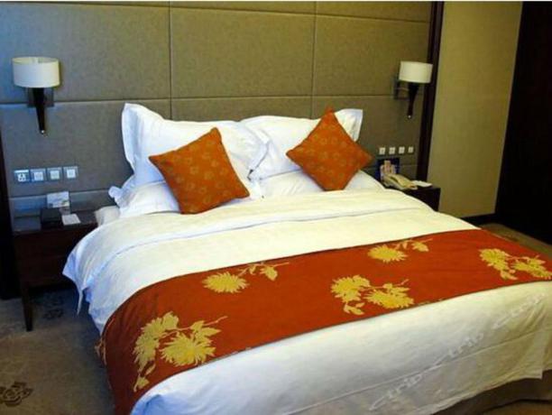 Imagen de la habitación del Hotel Xinjiang Plaza Guest Building. Foto 8