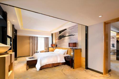 Imagen de la habitación del Hotel Xinjiang Tianyuan. Foto 8