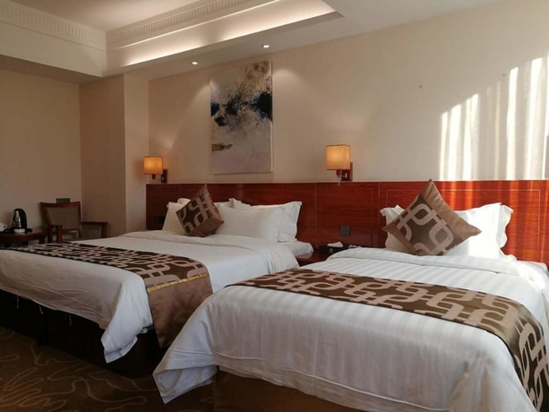 Imagen de la habitación del Hotel Xinjiayuan. Foto 11