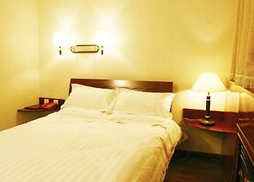 Imagen de la habitación del Hotel Xinmao Youth. Foto 3