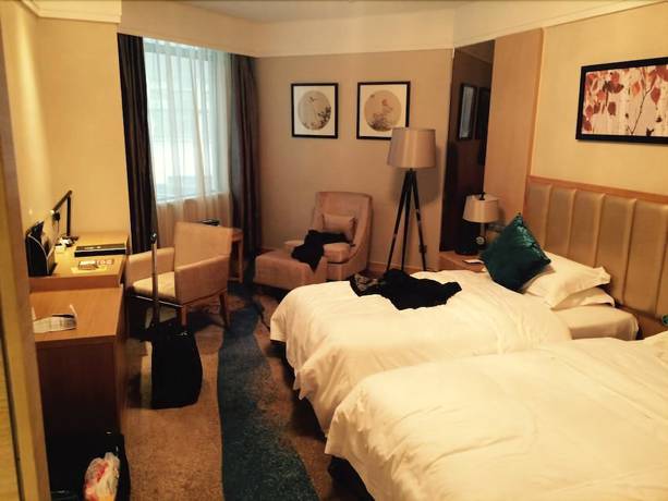 Imagen de la habitación del Hotel Xinxing Century Hotel. Foto 5