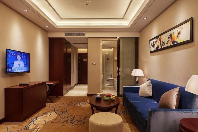 Imagen de la habitación del Hotel Xinxing Century Hotel. Foto 9