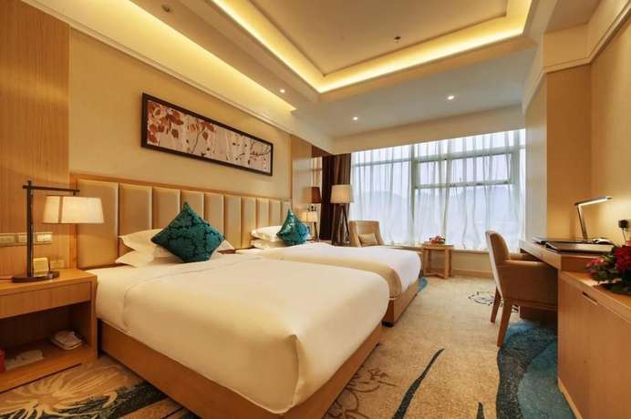 Imagen de la habitación del Hotel Xinxing Century Hotel. Foto 16