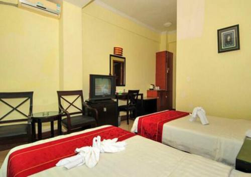 Imagen de la habitación del Hotel Xinxing Garden. Foto 7