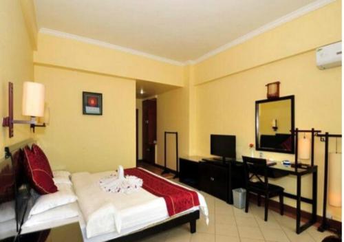 Imagen de la habitación del Hotel Xinxing Garden. Foto 8