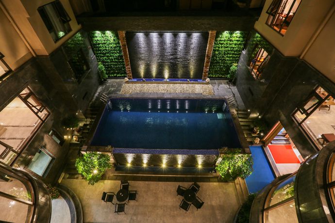 Imagen de la piscina del Hotel Xishuangbana Yunshangpin. Foto 20