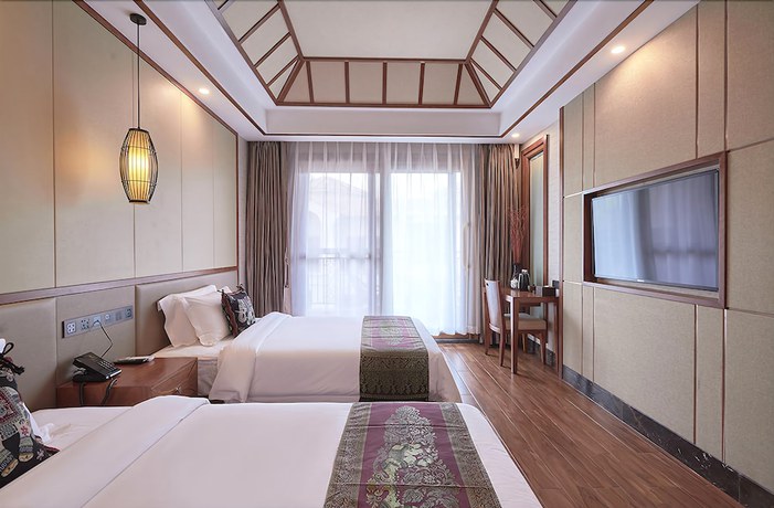 Imagen de la habitación del Hotel Xishuangbana Yunshangpin. Foto 11