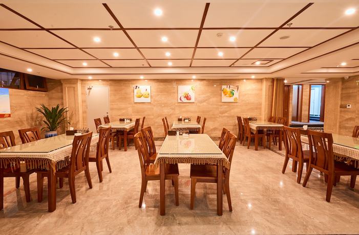 Imagen del bar/restaurante del Hotel Xishuangbana Yunshangpin. Foto 6