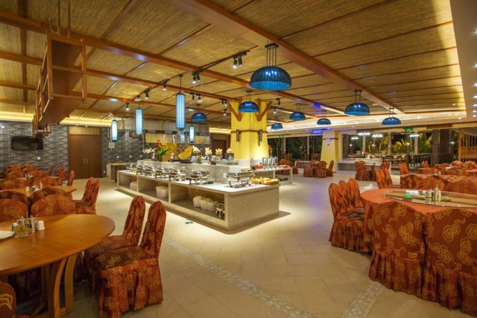 Imagen del bar/restaurante del Hotel Xishuangbanna Yajule City Golf. Foto 2