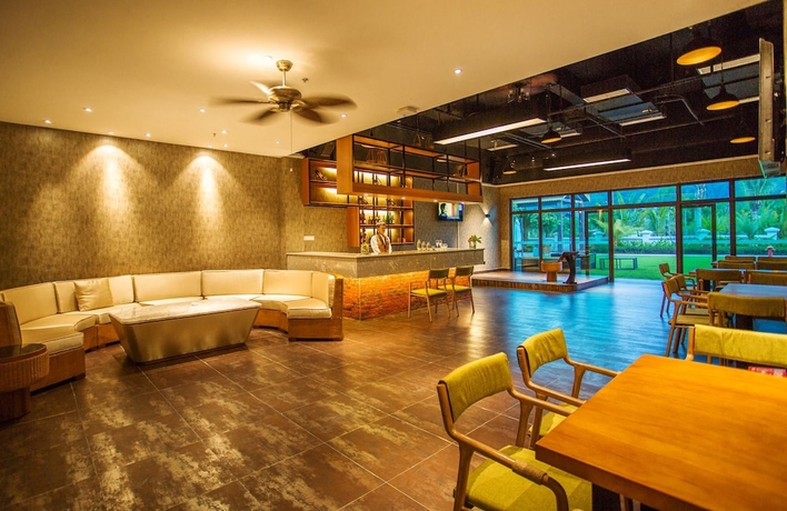Imagen del bar/restaurante del Hotel Xishuangbanna Yajule City Golf. Foto 3
