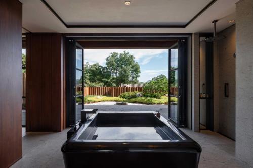 Imagen de la habitación del Hotel Xitan Beijing. Foto 11