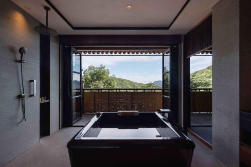 Imagen de la habitación del Hotel Xitan Beijing. Foto 12