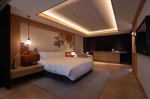 Imagen de la habitación del Hotel Xitan Beijing. Foto 16
