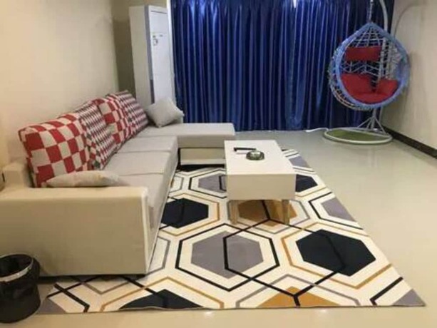 Imagen de la habitación del Hotel Xitishu Apartment. Foto 12