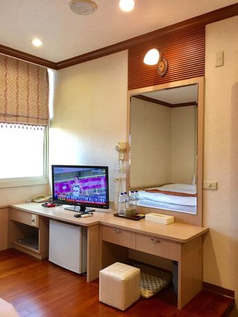 Imagen de la habitación del Hotel Xiu Shui. Foto 2