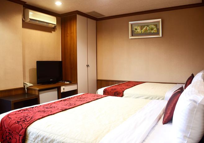 Imagen de la habitación del Hotel Xiu Shui. Foto 5