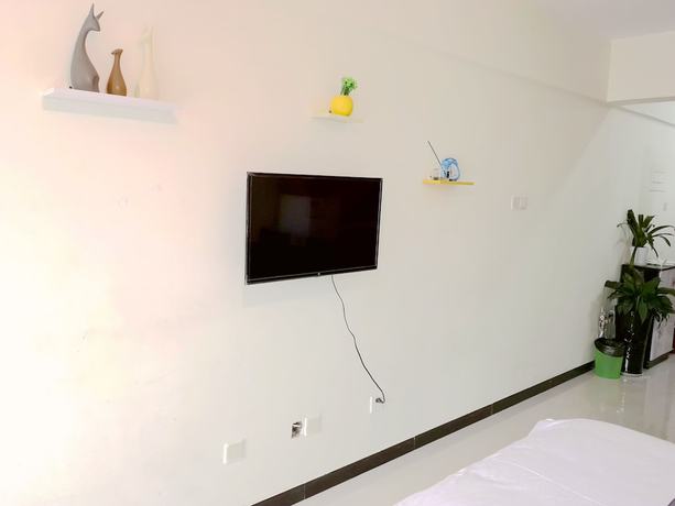 Imagen de la habitación del Hotel Xiwangju Apart-hotel. Foto 14