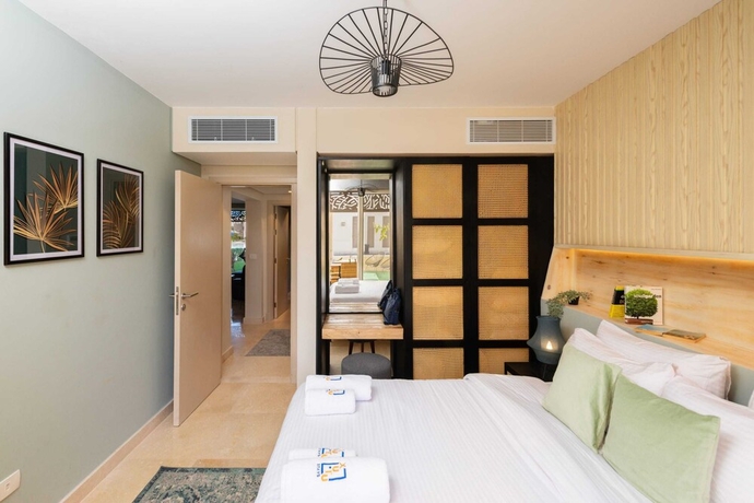 Imagen de la habitación del Hotel Xuru Stays I Sparky and Summery 2 BDR @ Mangroovy Free Beach and Pool Access. Foto 5