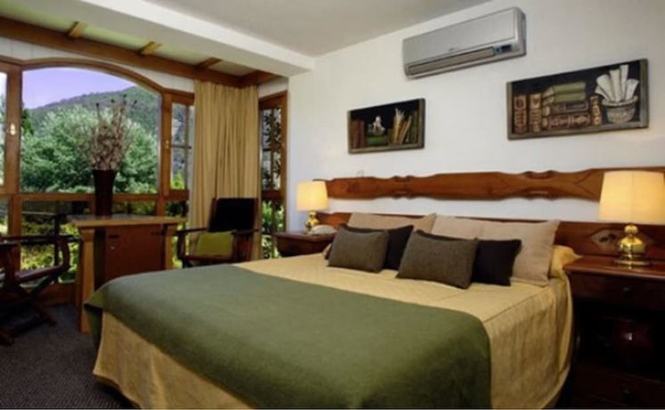 Imagen de la habitación del Hotel Y Caba&ntilde;as Le Village. Foto 10