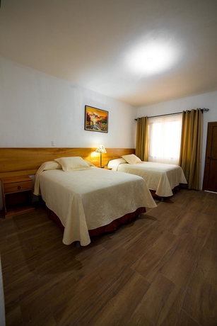 Imagen de la habitación del Hotel Y Centro De Convenciones Jardines Del Lago. Foto 5