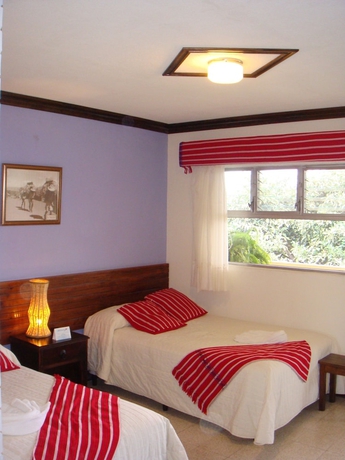 Imagen de la habitación del Hotel Y Centro De Convenciones Jardines Del Lago. Foto 7