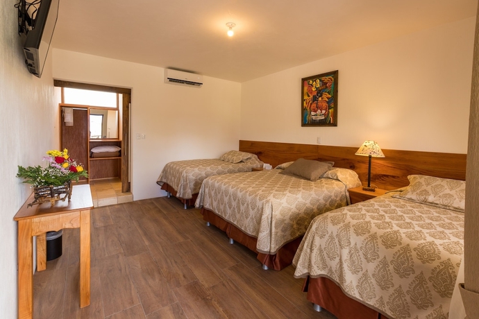 Imagen de la habitación del Hotel Y Centro De Convenciones Jardines Del Lago. Foto 9