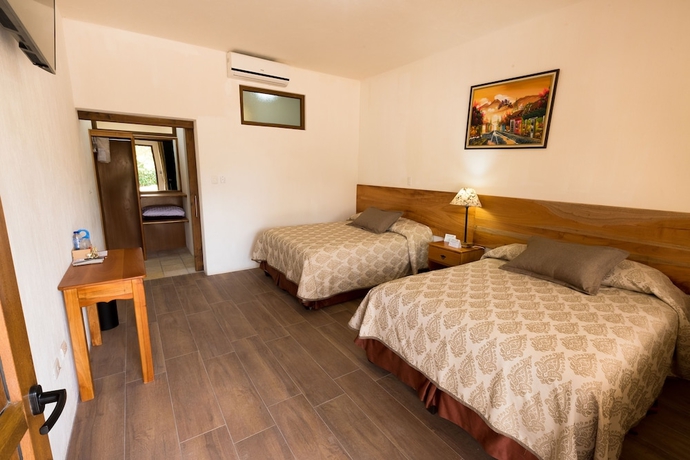 Imagen de la habitación del Hotel Y Centro De Convenciones Jardines Del Lago. Foto 11