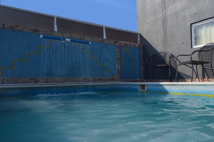 Imagen de la piscina del Hotel Y Suites Bausan. Foto 19