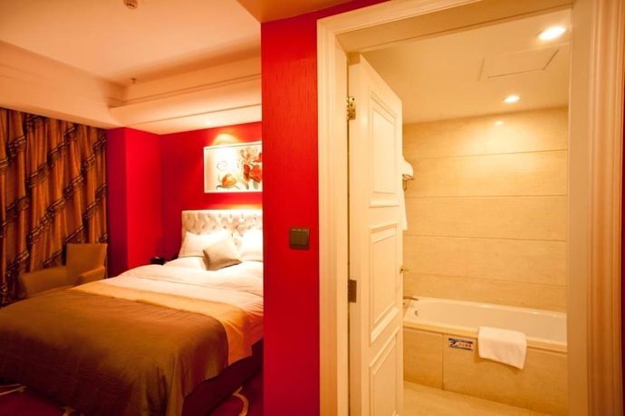Imagen de la habitación del Hotel YINHAO HOLIDAY HOTEL. Foto 3