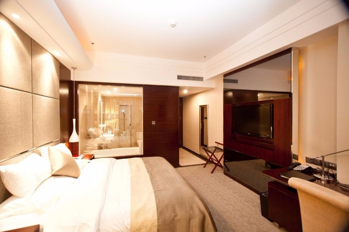 Imagen de la habitación del Hotel YINHAO HOLIDAY HOTEL. Foto 5
