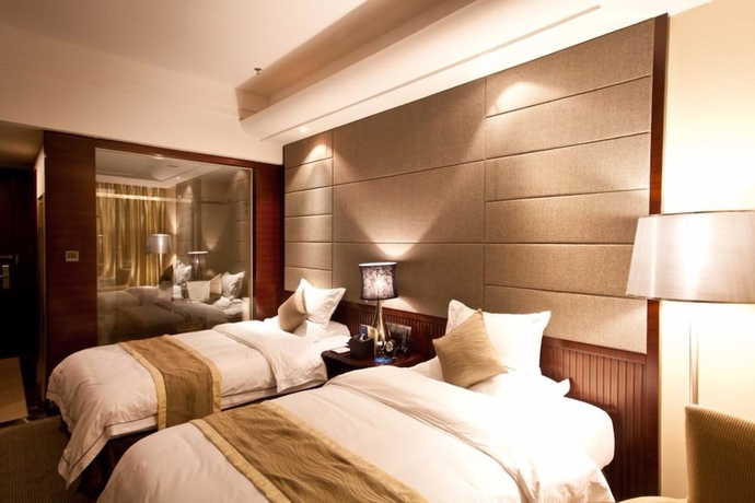 Imagen de la habitación del Hotel YINHAO HOLIDAY HOTEL. Foto 6