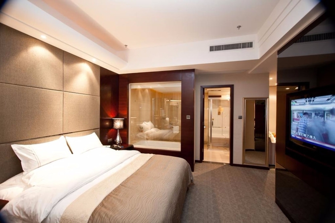 Imagen de la habitación del Hotel YINHAO HOLIDAY HOTEL. Foto 7